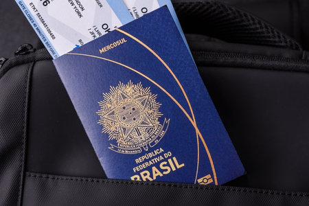 Brazil passport, visa for travel, document with tickets in travel bag. Brazilian passport as background for your designの写真素材
