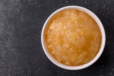 Apple sweet sauce, baby food, canned ingredient for desserts. Apple sauce as food background for...