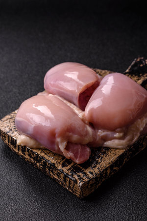 Chicken or turkey raw thigh fillet, skinless and boneless poultry meat. Chicken thigh fillet as food background for your designの写真素材