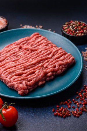 Raw ground beef or pork, fresh meat for burgers or other dishes. Raw ground beef as a food backgroundの写真素材