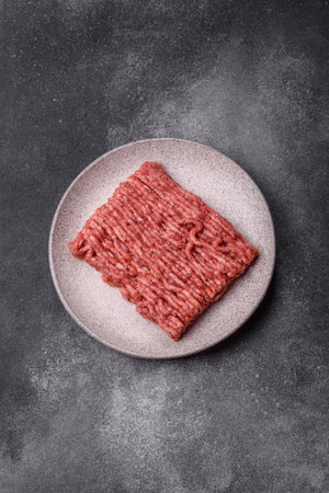 Raw ground beef or pork, fresh meat for burgers or other dishes. Raw ground beef as a food backgroundの写真素材