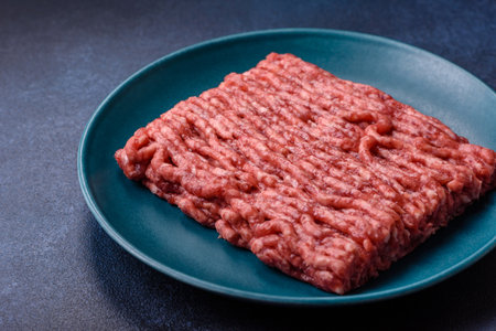 Raw ground beef or pork, fresh meat for burgers or other dishes. Raw ground beef as a food...