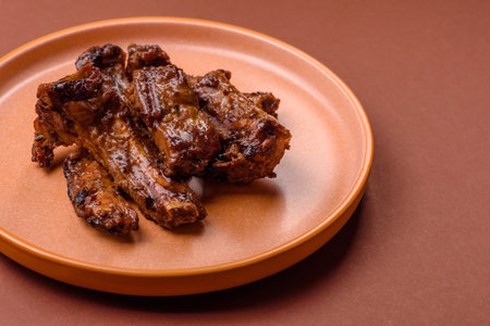 Grilled beef or pork ribs, meat cooked on a barbecue with salt and pepper. Grilled ribs as a food...