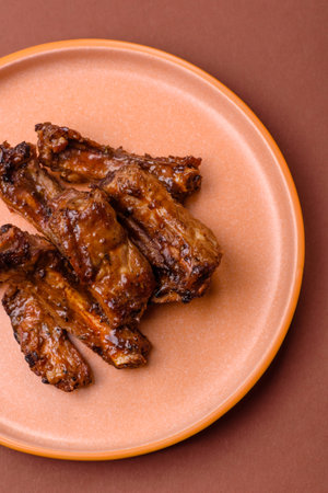 Grilled beef or pork ribs, meat cooked on a barbecue with salt and pepper. Grilled ribs as a food...