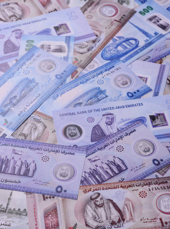 UAE money, dirhams, cash arabic banknotes for financial and business processes. Emirates cash as a...
