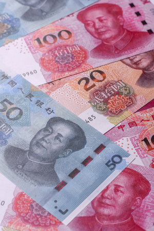 Chinese paper money, yuan in various denominations. China money as a business background for your...