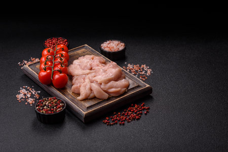 Strips of raw chicken or turkey fillet, skinless and boneless poultry breast. Chicken fillet strips are a high-protein foodの写真素材