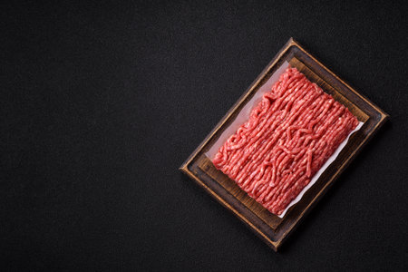 Raw ground beef or pork, prepared meat for burgers or other food preparation. Raw ground beef as a...