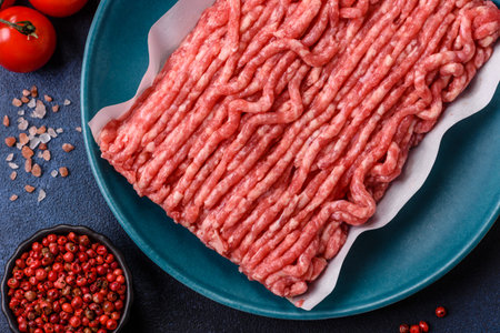 Raw ground beef or pork, prepared meat for burgers or other food preparation. Raw ground beef as a...