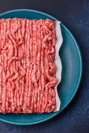 Raw ground beef or pork, prepared meat for burgers or other food preparation. Raw ground beef as a...
