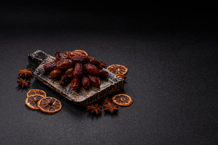 Dried dates in a ceramic plate. Dried dates as a food backdrop for your design.
