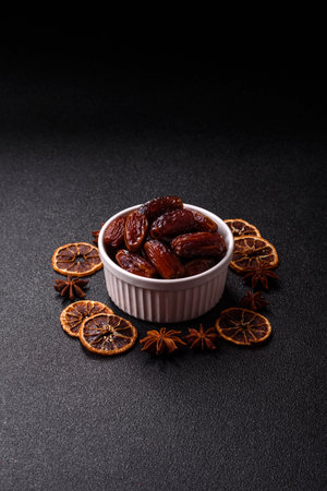 Dried dates in a ceramic plate, arabic food for the ramadan table. Dried dates as a food backdrop...