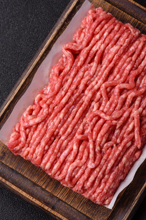 Raw ground beef or pork, prepared meat for burgers or other food preparation. Raw ground beef as a...
