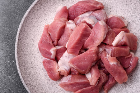 Raw pork, sliced, fresh meat, a source of protein, and an ingredient for a hearty meal. Raw pork as...