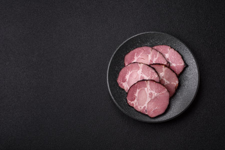 Ham, a meat cooked and sliced for sandwiches or Christmas table. Ham slices as a food background for your designの写真素材