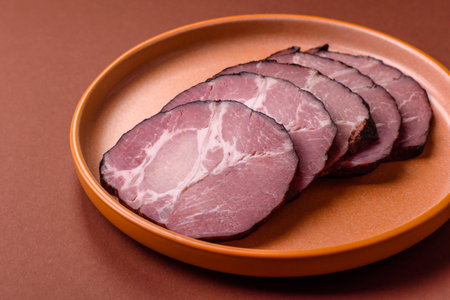 Ham, a meat cooked and sliced for sandwiches or Christmas table. Ham slices as a food background for your designの写真素材