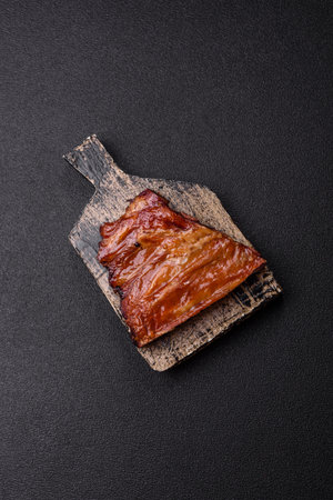 Grilled or barbecued pork or beef ribs with sauce. Cooked or smoked ribs as a food backdrop for your designの写真素材
