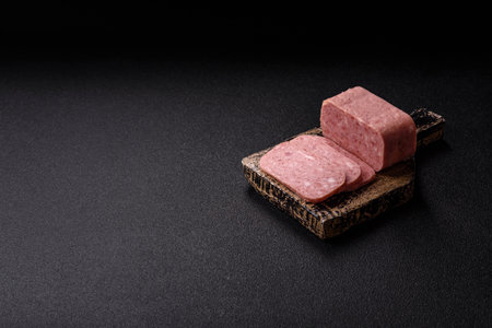 Spiced ham slices, canned meat for lunch sandwiches. Spiced ham as a food backdrop for your design.の写真素材