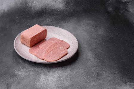 Spiced ham slices, canned meat for lunch sandwiches. Spiced ham as a food backdrop for your design.