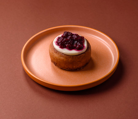Cinnamon roll, a sweet bun with citrus, cherries, and chocolate, a Danish dessert with cream.