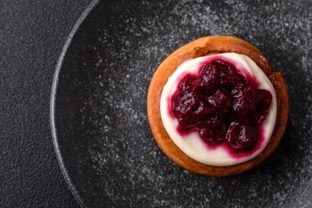 Cinnamon roll, a sweet bun with citrus, cherries, and chocolate, a Danish dessert with cream....