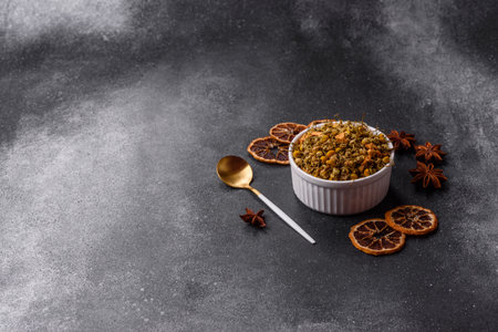 Dried chamomile flowers, herbal tea in a bowl for a hot morning drink. Dried chamomile as a background for your design.の写真素材