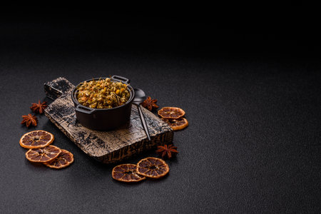 Dried chamomile flowers, herbal tea in a bowl for a hot morning drink. Dried chamomile as a background for your design.の写真素材