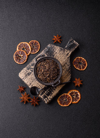 Golden black tea, dried leaves of a Chinese or Indian breakfast drink. Black tea dried leaves as a food backdrop for your designの写真素材