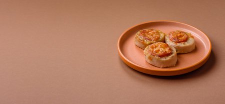 Round fish or chicken cutlets baked with tomato and cheese.