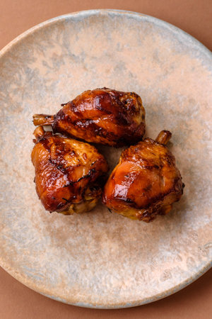 Fried chicken legs with teriyaki sauce, oven baked meat. Chicken legs as a food backdrop for your designの写真素材