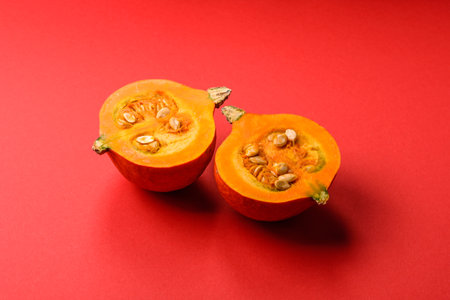 Half a raw pumpkin, a ripe orange colored butternut squash. Raw pumpkin as a background for your designの写真素材