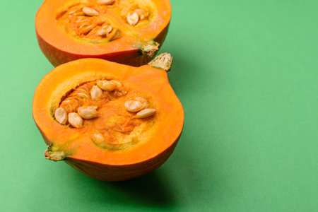 Half a raw pumpkin, a ripe orange colored butternut squash. Raw pumpkin as a food background for your designの写真素材