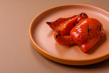 Grilled red bell peppers, vegetarian food. Red bell peppers as a food background for your design.の写真素材