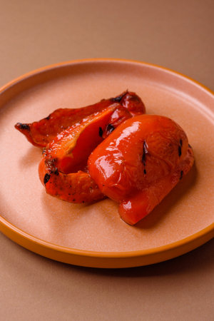 Grilled red bell peppers, vegetarian food. Red bell peppers as a food background for your design.の写真素材