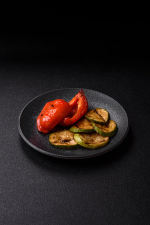 Grilled red bell peppers, vegetarian food. Red bell peppers as a food background for your design.の写真素材