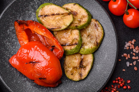 Grilled red bell peppers, vegetarian food. Red bell peppers as a food background for your design.の写真素材