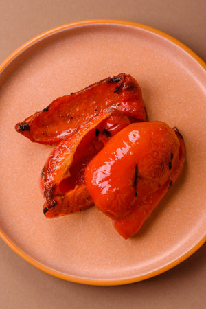 Grilled red bell peppers, vegetarian food. Red bell peppers as a food background for your design.の写真素材