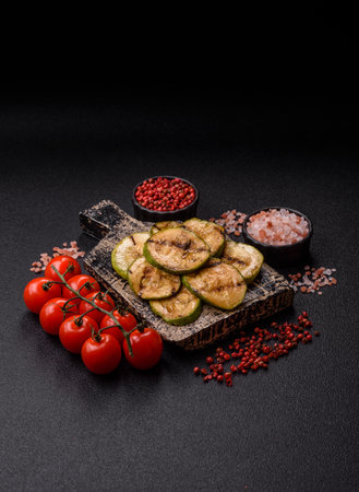 Grilled green zucchini slices, vegetarian food. Green barbecue zucchini as a food background for your designの写真素材