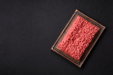 Raw ground beef for a burger or as an ingredient in a meat dish. Raw ground beef as a food background for your designの写真素材