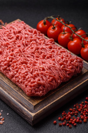 Raw ground beef for a burger or as an ingredient in a meat dish. Raw ground beef as a food background for your designの写真素材