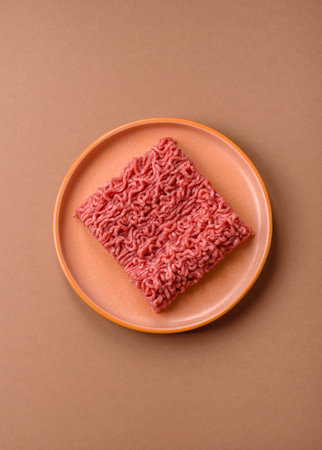 Raw ground beef for a burger or as an ingredient in a meat dish. Raw ground beef as a food background for your designの写真素材