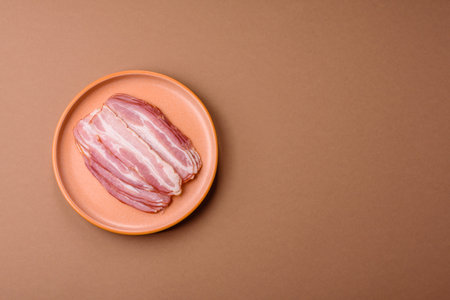 Meat, raw pork bacon sliced, protein for snacks. Raw bacon as a food background for your designの写真素材