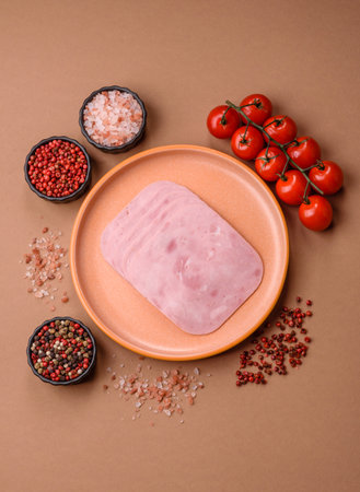 Meat, square ham sliced, protein for snacks. Sliced ham as a food background for your designの写真素材
