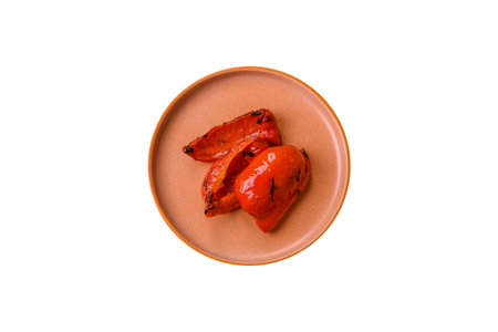 Grilled red bell peppers, vegetarian food. Red bell peppers as a food background for your design.の写真素材
