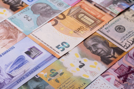 Paper money, banknotes of different countries in several denominations as a business background. Paper money and cash as a financial background for your design.の写真素材