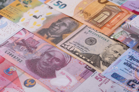 Paper money, banknotes of different countries in several denominations as a business background. Paper money and cash as a financial background for your design.の写真素材
