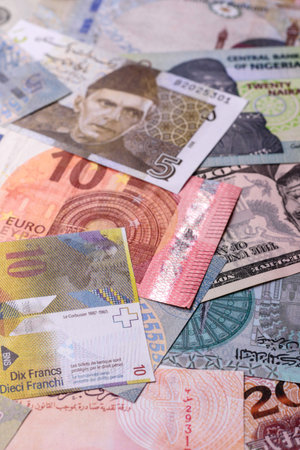 Paper money, banknotes of different countries in several denominations as a business background. Paper money and cash as a financial background for your design.の写真素材
