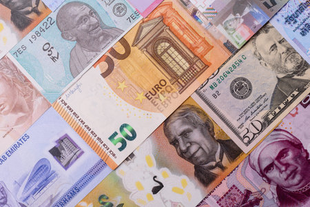 Paper money, banknotes of different countries in several denominations as a business background....