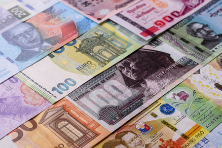 Paper money, banknotes of different countries in several denominations as a business background. Paper money and cash as a financial background for your design.の写真素材