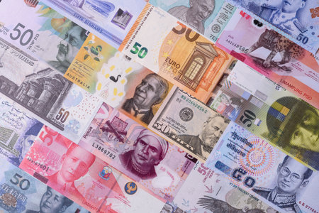 Paper money, banknotes of different countries in several denominations as a business background....
